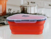 Red collapsible Pizza Pack pizza storage container on a white counter.