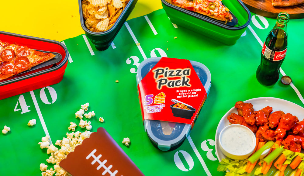 Various Pizza Packs with assorted food on a football field