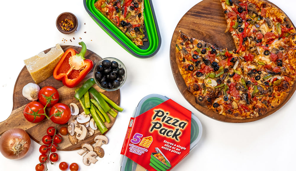 Green Pizza Packs with a pizza and veggies on a cutting board